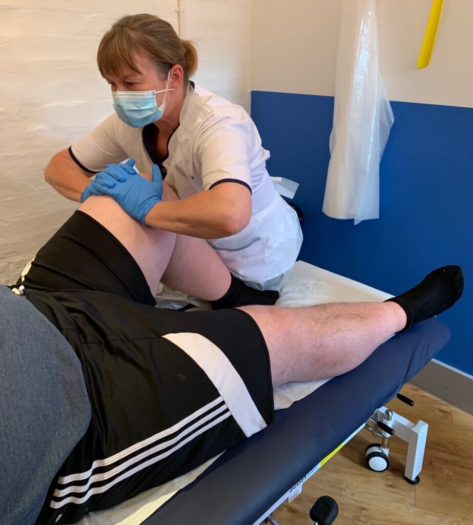 Laura treating a client with osteopathic teatment